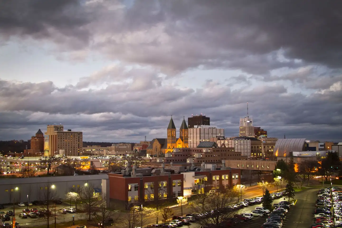Downtown Akron, Ohio, at dusk under an overcast sky
