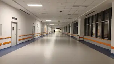 Wide corridor view in a modern hospital, Ankara, Türkiye. Well-lit and clean interior.