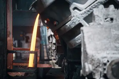 Molten metal being poured from vats in a steel mill