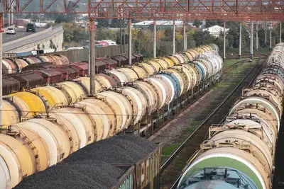 Freight train cars loaded with cargo at a rail yard