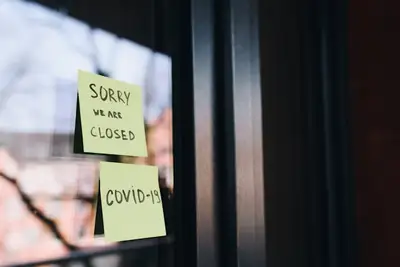 A sign on a door reading 'sorry we are closed'