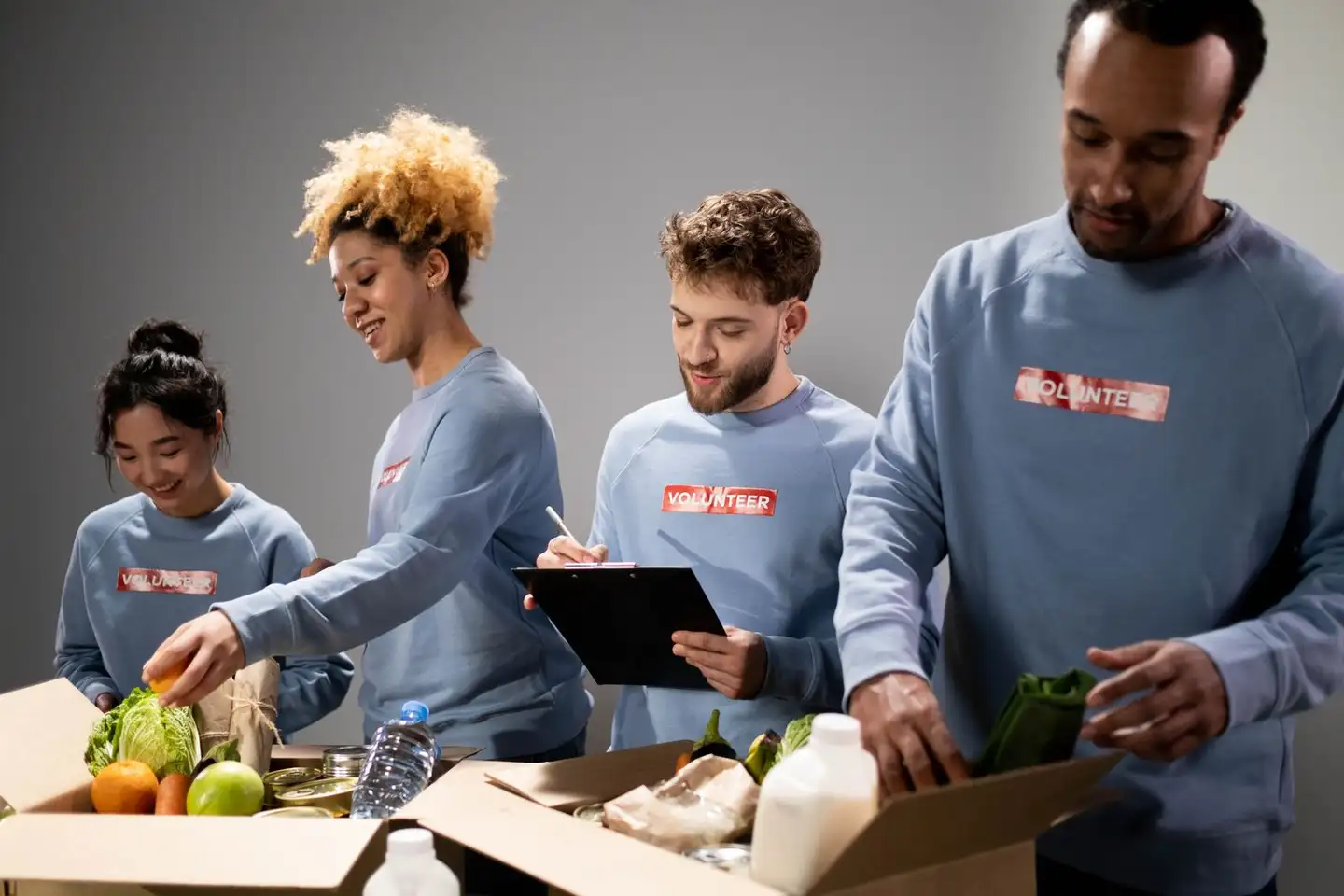 Volunteers working together to pack donation boxes