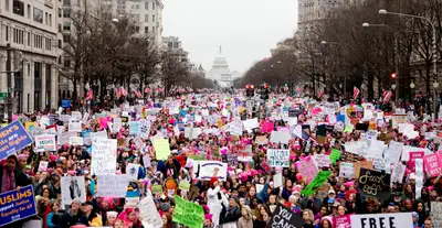 A crowd holding placards at a march